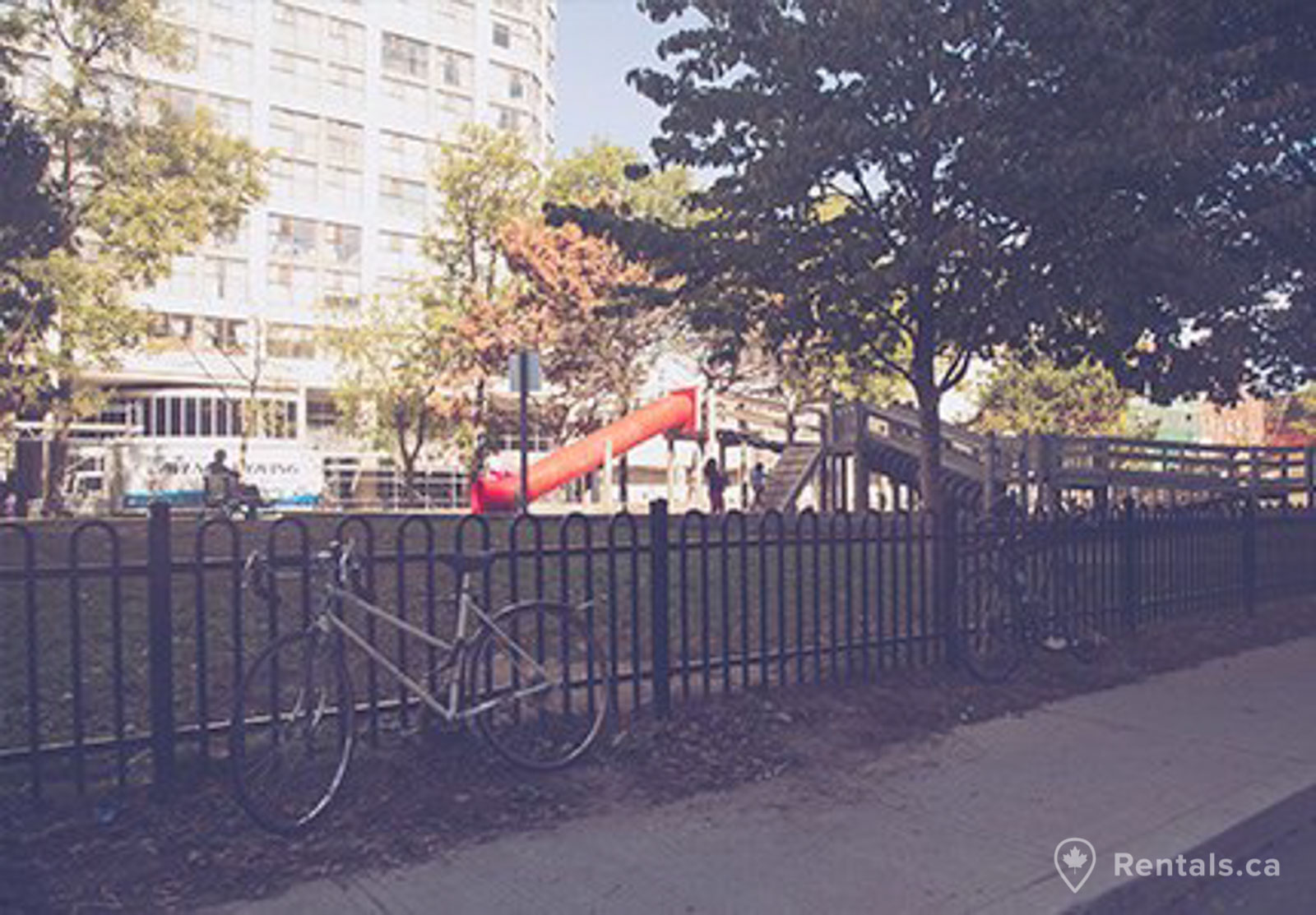 Apartment building with units for rent and enough space for community playground in the St. Lawrence neighbourhood