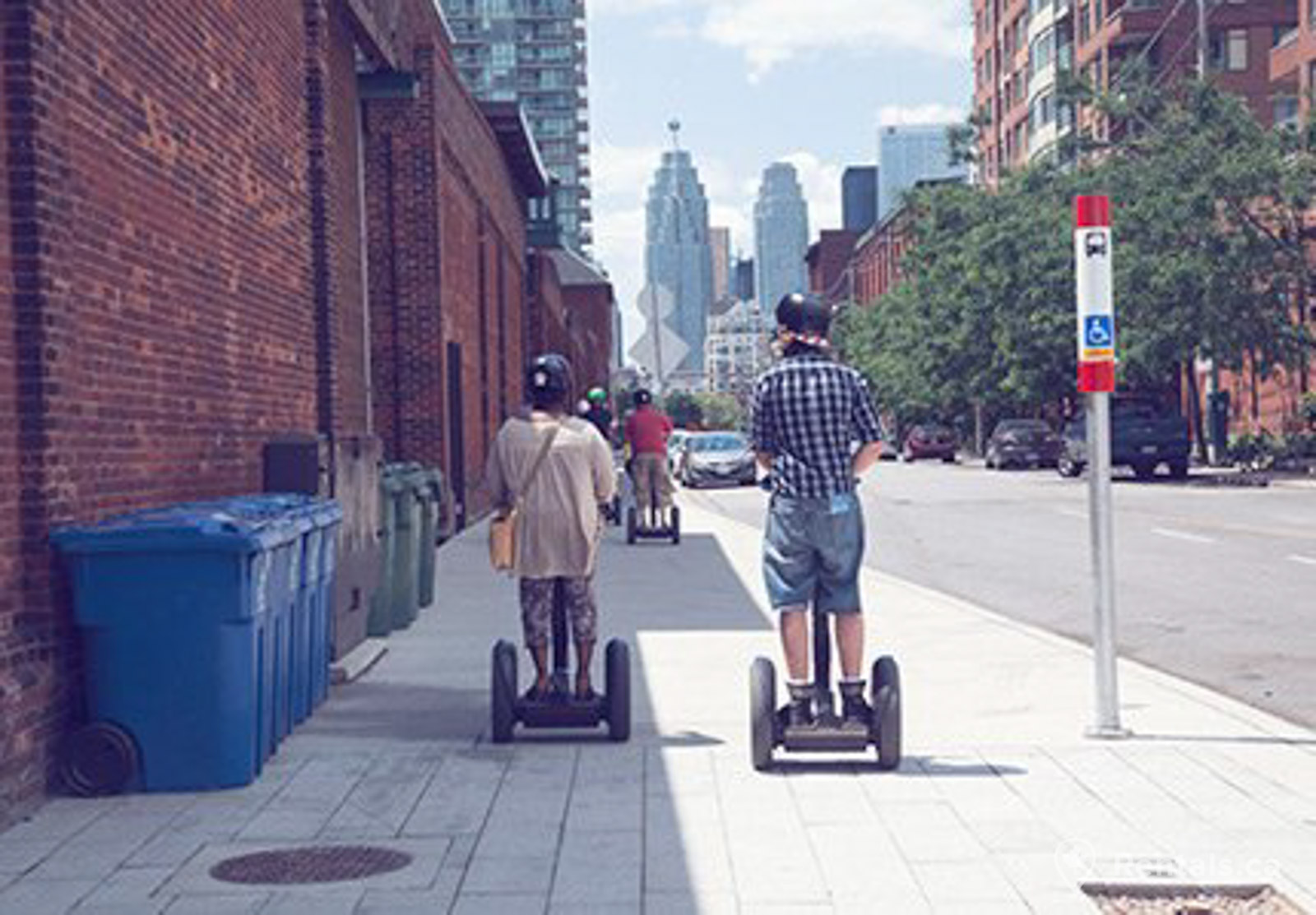 Distillery district tourists exploring the old world community near new condo developments and rental homes